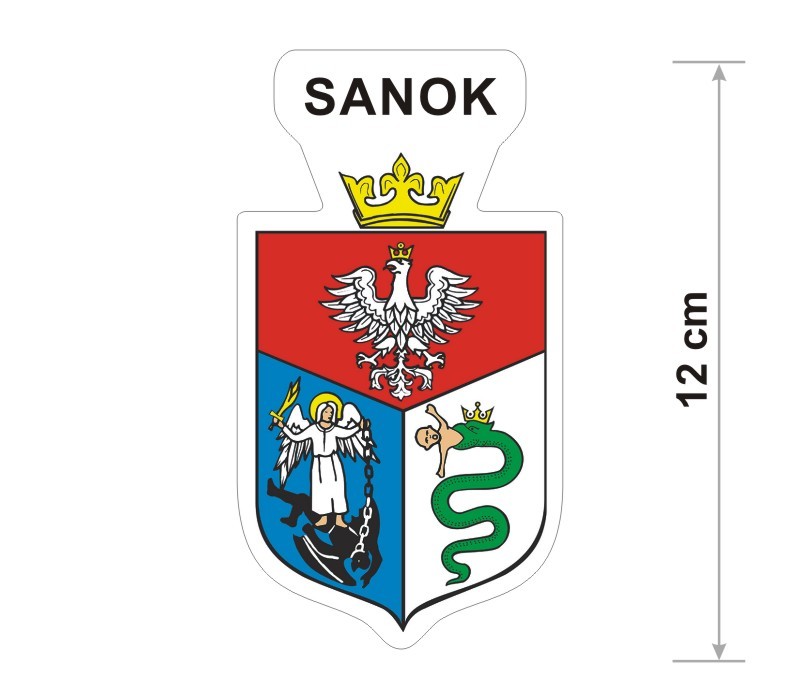 Naklejka z herbem Sanoka, nad herbem jest umieszczony napis Sanok. Herb wraz z nazwą otoczone są białą obwódką stanowiącą białe tło naklejki. Obok podano wymiar wysokości naklejki - 12 cm.
