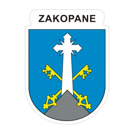 Naklejka z herbem Zakopanego i napisem Zakopane nad herbem, herb i napis posiadają białą obwódkę, która jest białym tłem dla herbu Zakopanego i napisu. Wymiar naklejki 12 cm wysokości.