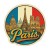 Naklejka Paryż z symbolami tego miasta, napisem Paris i flagą Francji w tle. Naklejka jest wodoodporna, okrągła i kolorowa z kremową obwódką.