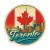 Naklejka Toronto z symbolami tego miasta, napisem Toronto i flagą Kanady w tle. Naklejka jest wodoodporna, okrągła i kolorowa z kremową obwódką.